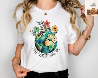 May include: White t-shirt with a watercolor illustration of the Earth surrounded by flowers. The text "Make Every Day Earth Day" is printed below the Earth.