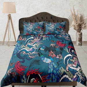 May include: A teal blue duvet cover with a colorful dragon and peacock design. The duvet cover features a repeating pattern of dragons, peacocks, and flowers.