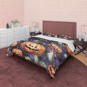 May include: A black and purple Halloween themed duvet cover with a watercolour design of jack-o'-lantern pumpkins, leaves, and a white bird.