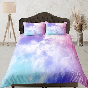 May include: A soft, pastel-colored duvet cover with a tie-dye cloud pattern in shades of pink, blue, and purple. The duvet cover is made of a soft, comfortable fabric and features a subtle sheen.