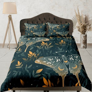 May include: A dark green duvet cover with a white and gold butterfly design. The duvet cover features a repeating pattern of butterflies and leaves.