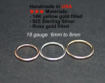 May include: Three small, circular rings in rose gold, silver, and gold colors are displayed against a dark background. The text indicates the rings are handmade in the USA, made of 14K gold filled, 925 sterling silver, and rose gold filled materials, 18 gauge, and 6mm to 8mm.