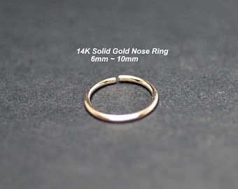 May include: A 14K solid gold nose ring. The ring is 6mm to 10mm in diameter.