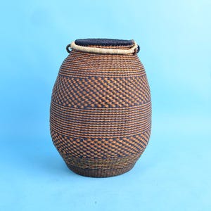 Handwoven straw sculptural basket| art statement basket| living room wicker floor bin
