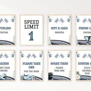 May include: Set of eight framed signs with a racing theme. Each sign features a watercolor illustration of a race track, checkered flags, and balloons. Text includes "Refueling Station", "Speed Limit 1", and "Gift & Card Parking".