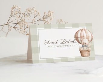 May include: A light green and white gingham patterned food label with the text "Food Labels" and "Add Your Own Text". A watercolor illustration of a teddy bear in a hot air balloon is on the right side of the label.