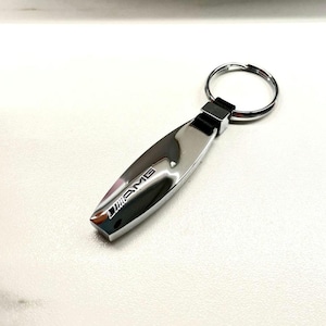 AMG keychain with Mercedes-Benz AMG logo. High-quality AMG keychain, Mercedes-Benz AMG logo.