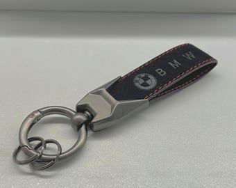 BMW key fob with BMW logo. Alcantara leather with red stitching. High-quality BMW Alcantara leather keychain with BMW logo.