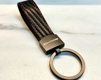 Mercedes-Benz AMG keychain in black, with AMG logo. High-quality Mercedes-Benz AMG keychain. AMG logo.