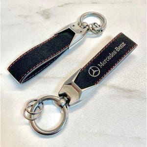 Mercedes-Benz keyring in black with red stitching. High quality Mercedes Benz Alcantara Leather Keychain. Mercedes Benz Logo