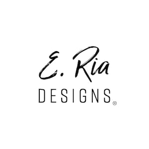 May include: Black and white logo for E. Ria Designs. The logo features a handwritten script font for the name "E. Ria" and a sans-serif font for the word "Designs".