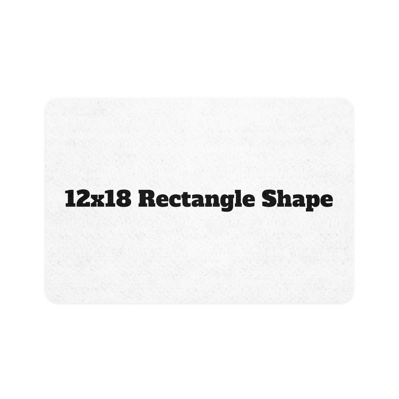 Peut inclure: Un objet rectangulaire blanc aux coins arrondis. Le texte "12x18 Rectangle Shape" est imprim&eacute; en lettres noires grasses au centre de l'objet. L'objet a une surface textur&eacute;e.