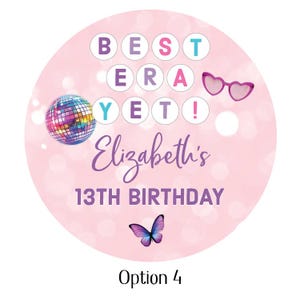 May include: A round, pink sticker with the text "BEST ERA YET!" in a circle, along with "Elizabeth's 13TH BIRTHDAY" in purple script. Includes a disco ball, heart-shaped sunglasses, and a butterfly.