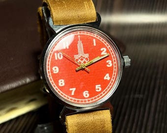 Reloj raro de los Juegos Olímpicos Soviéticos de 1980: esfera roja, estilo vintage.