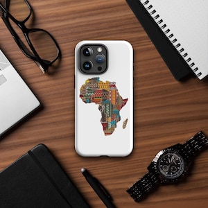 May include: White iPhone case featuring a colourful patterned map of Africa. The case has a camera lens cutout and a white background.