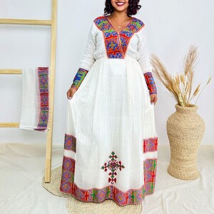 Ethiopian Handwoven White Dress | Vibrant Multicolor Tibeb & Cultural Cross Detail | Bold Habesha Kemis Hab210