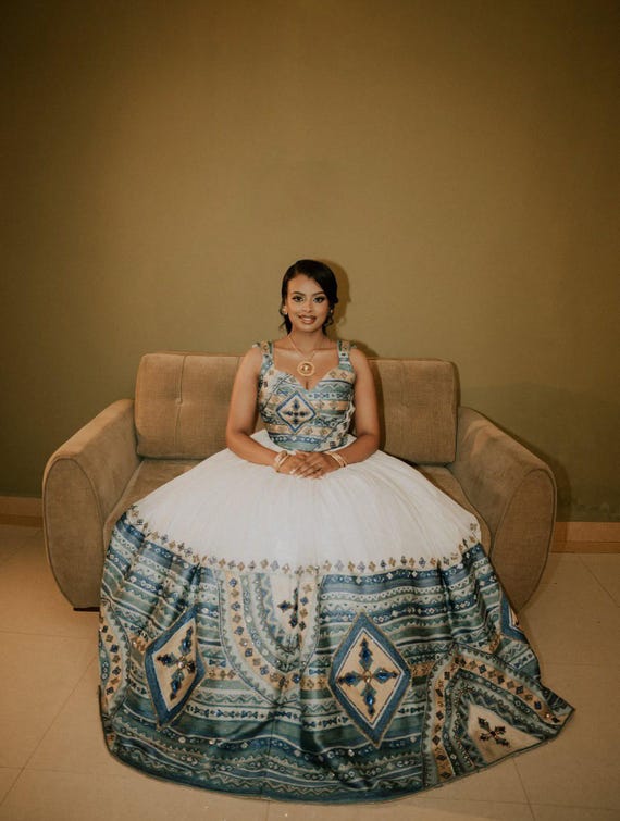 designer ethiopian wedding dress DIDI DESIGN & ALTERATIONS | Feel like a Gold Goddess with, this dress is not just an ensemble; it's a masterpiece that fuses modern style with ancient artistry,