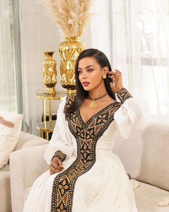 Heaven Black & Gold Embroidery Ethiopian Cloth | Cross Motif Cultural Habesha Dress | Classic Cultural Habesha Kemis Heaven Black & Gold Embroidery Ethiopian Cloth | Cross Motif Cultural Habesha Dress | Classic Cultural Habesha Kemis