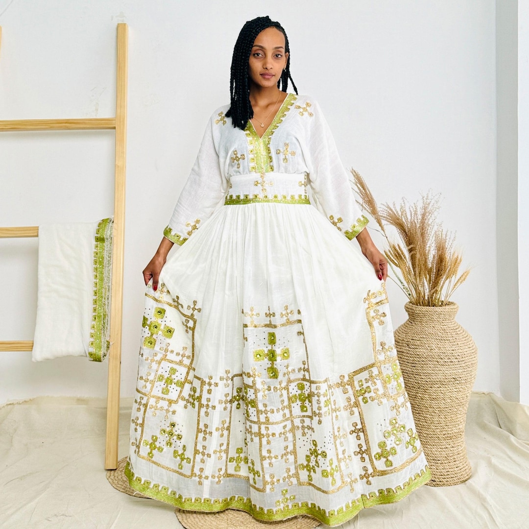 habesha dress design Gold Shiffon Elegant Silk-Soft Traditional Ethiopian D Embrace your culture and make a statement on your special day! Lovely traditional habesha dress features