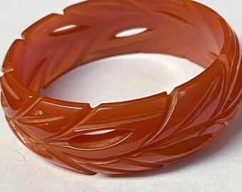 vintage Bakelite carved orange bangle bracelet