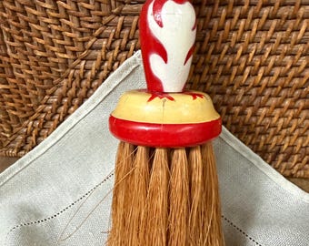 Red Penguin wisk broom