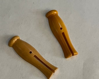 Vintage butterscotch Bakelite clothespins buttons