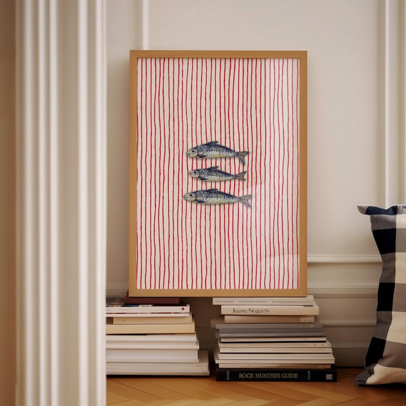 Striped sardines printable wall art displayed in a modern coastal kitchen setting