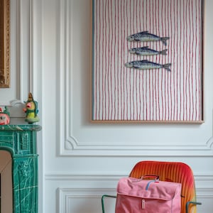 Striped sardines printable wall art displayed in a modern coastal kitchen setting