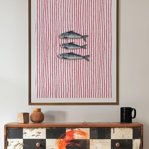 Striped sardines printable wall art displayed in a modern coastal kitchen setting