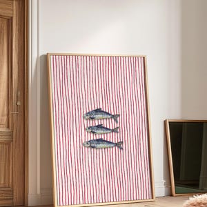 Striped sardines printable wall art displayed in a modern coastal kitchen setting