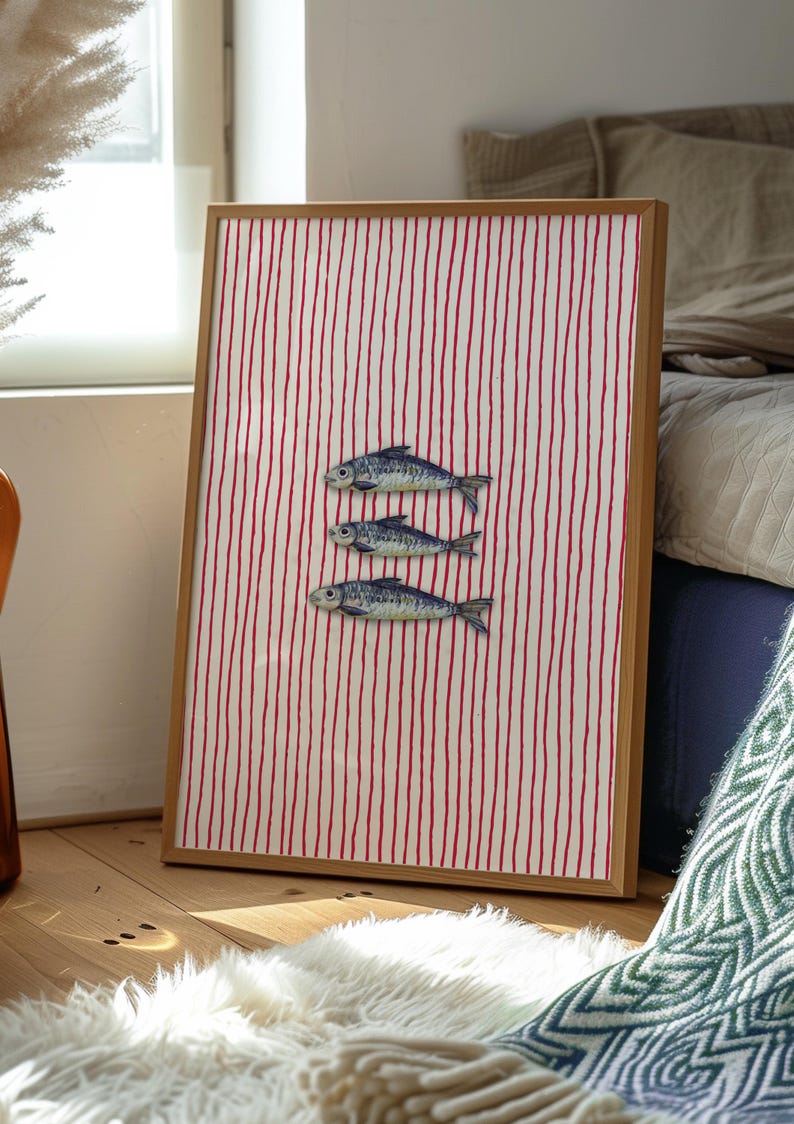 Striped sardines printable wall art displayed in a modern coastal kitchen setting