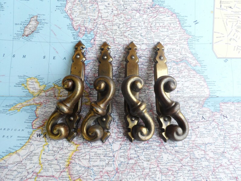 SALE 4 curvy distressed brass metal pulls w/slim trimplates image 1