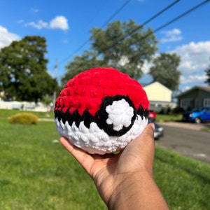 May include: A set of three ceramic mugs with a speckled, cream-colored glaze. Each mug features a different hand-painted floral design in shades of blue, green, and yellow. The mugs have a simple, rounded shape and a comfortable handle.