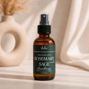 May include: A brown glass bottle of linen room spray with a black spray nozzle. The label reads "Rosemary Sage Aromatherapy" and "4 oz 118 ml". The product is from Long Island Candle & Fragrance Co.