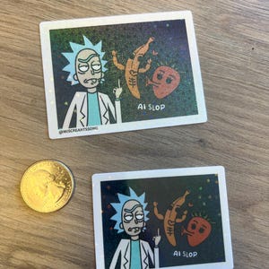 May include: Two rectangular holographic stickers featuring a cartoon character with spiky blue hair and a white lab coat, a yellow banana, and a red strawberry. The text AI SLOP and @MISCREANTSSONG is printed on each. A US quarter coin is shown for scale.