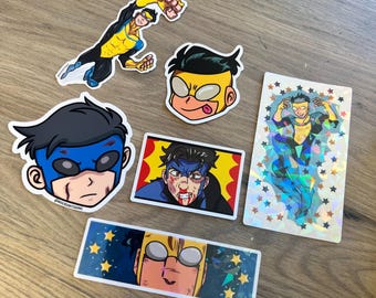 May include: A collection of six Invincible stickers featuring various illustrations of the character in yellow and blue suits, including headshots, action poses, and a rectangular holographic sticker with a star pattern overlay.