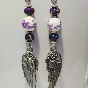 Silver plated Wing earrings with purple stone and white ceramic beads