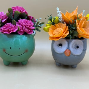 Whimsical Sola Wood Flower Arrangements in Adorable Groot Planters