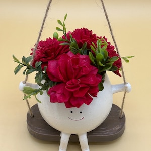 Charming Sola Flower Arrangement in Hanging Smiley Pot