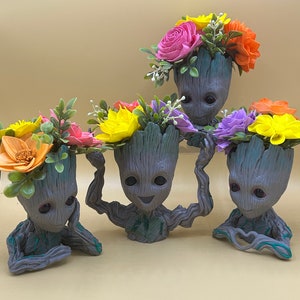 Whimsical Sola Wood Flower Arrangements in Adorable Groot Planters