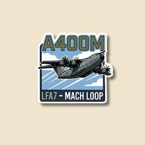 May include: A sticker depicting a grey A400M military transport aircraft in flight. The sticker has a blue and white background with the text "A400M" and "LFA7 - MACH LOOP" in a bold font.