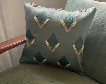 Green tasselled diamond print cushion