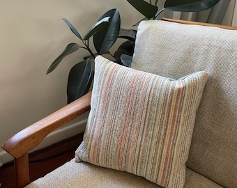 Blue yellow orange cream striped and spotty cushion