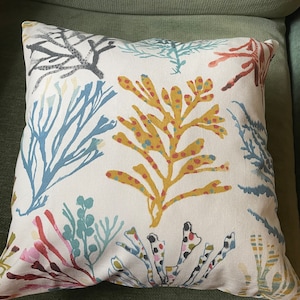 Colourful coral blue green red yellow olive cushion image 1