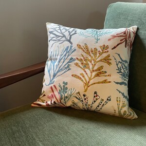 Colourful coral blue green red yellow olive cushion image 2
