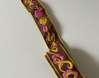 Brown pink and yellow abstract floral woven ribbon