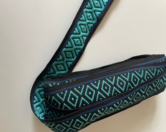 Turquoise and black diamond print woven ribbon with royal blue stripe