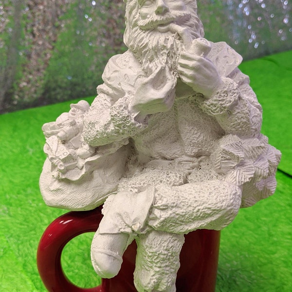 Shelf Sitting Santa Clause Christmas Statue with paints and brushes. Paint your own DIY plaster figurine Art Craft activity.