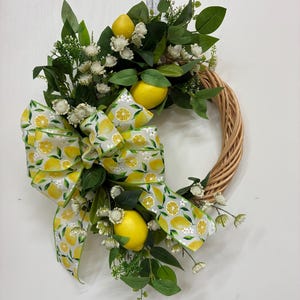 Lemon Wreath with tiny white flowers and mixed greens