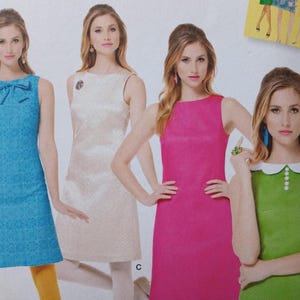 May include: Image of a sewing pattern showing four sleeveless dresses in turquoise, cream, hot pink, and green. The dresses have different necklines and details, including a bow, a brooch, and a white collar.